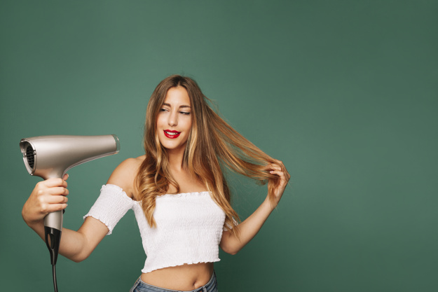 happy-girl-with-hairdryer_23-2147643786